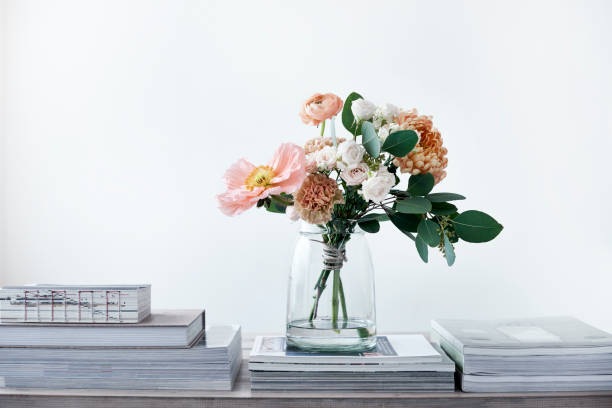 pastel cut flowers in a glass vase bouquet of poppies ranunculus eucalyptus chrysanthemums roses carnations bunch of flowers photos stock pictures, royalty-free photos & images