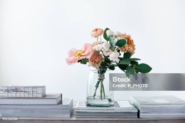Pastel Cut Flowers In A Glass Vase Stock Photo - Download Image Now - Vase, Bouquet, Table