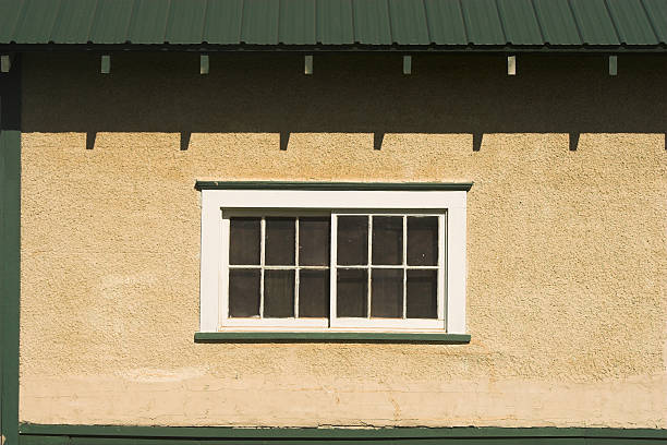 Window and stucco wall stock photo