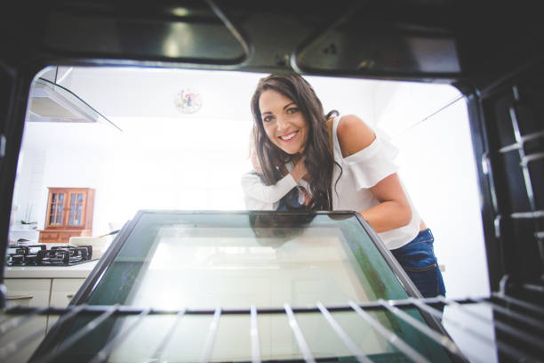 istock Beautiful brunette female model working in her stylish kitchen 912158258