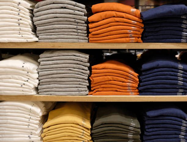 istock Rows of folded colorful clothes in a shop 912159104