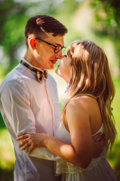 istock Young beautiful couple on a blurred natural background 912173684