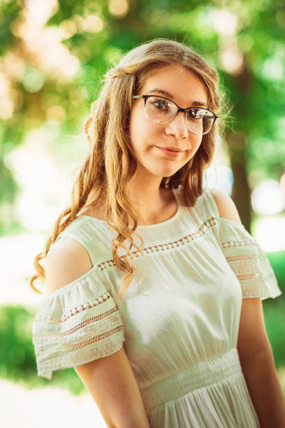 istock Beautiful young girl on natural background 912174118