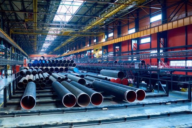 Modern pipe-rolling plant with steel tubes stock photo