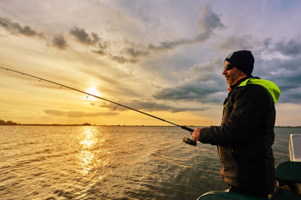 istock fishing in the sunrise 912174932