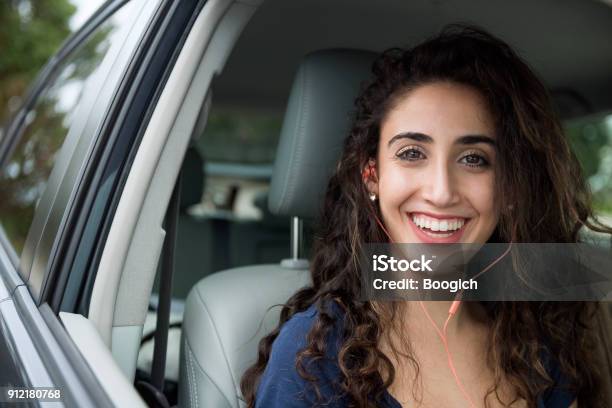 Smiling Millennial Woman Listens To Funny Podcast In Passenger Seat Stock  Photo - Download Image Now - iStock