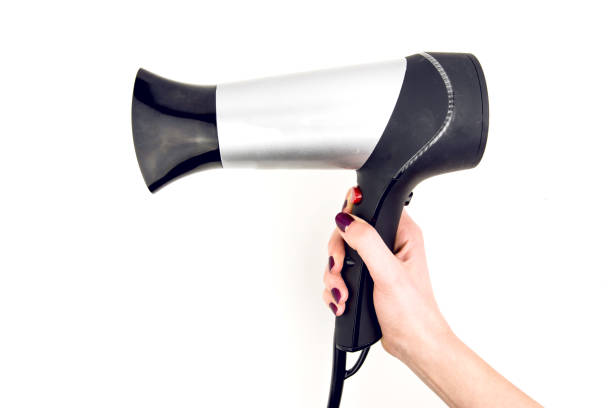 istock Hand Holding Hairdryer 912180970