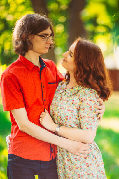 istock Beautiful young couple on the park background 912182300