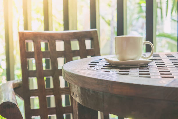istock Close-Up Of Coffee Cup On Wooden Table 912183444