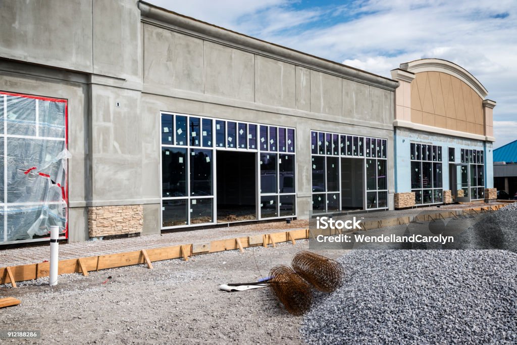 Small Strip Retail Center Under Construction A new retail strip center under construction. Construction Industry Stock Photo