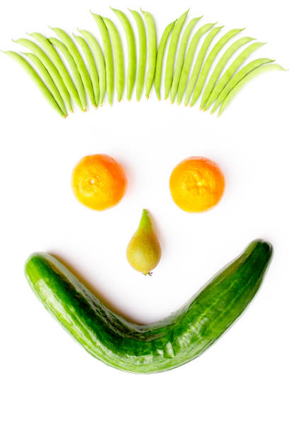 istock Face made of fruits and vegetables on white 912190208