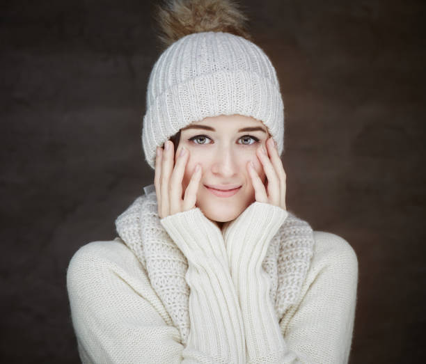 istock Young woman in white worm winter sweater. 912191250