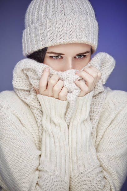 istock Young woman in white worm winter sweater. 912191718