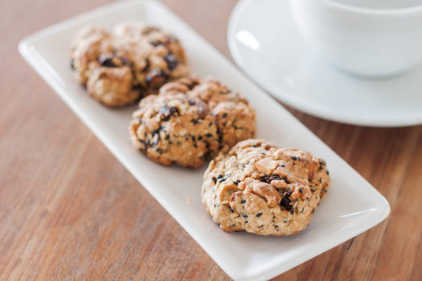 istock Close-Up Of Cookies And Coffee Cup On Table 912195740