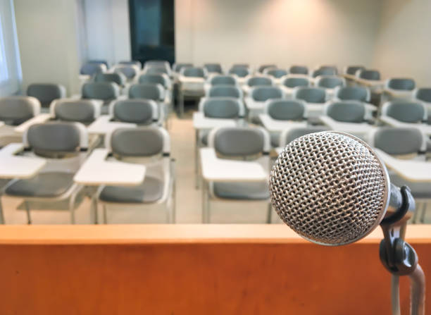 istock Microphone in Conference Seminar room Event and Meeting Background 912200666