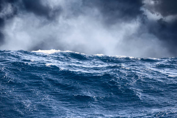 istock Sea wave surface close-up with storm clouds in the background 912205396