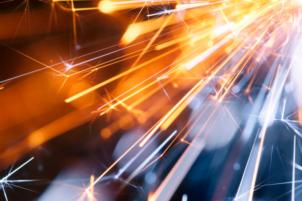Abstract Diagonal Red Blue Sparks - Background Party New Year Celebration Technology Macro photography of sparks. Great background image for party, celebration or technology. abstract technology orange stock pictures, royalty-free photos & images