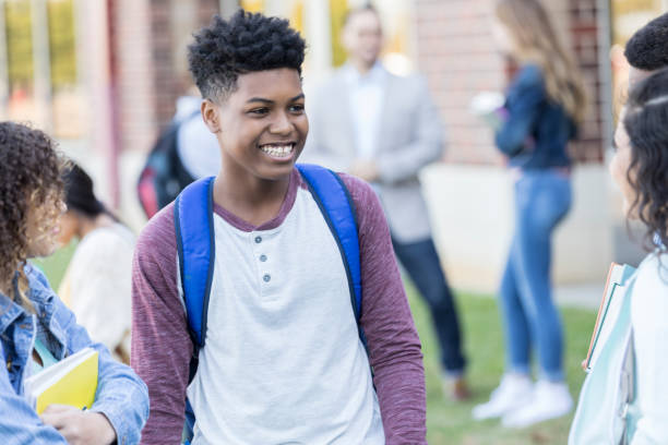 istock Handsome teenage boys laughs with friends 912208280