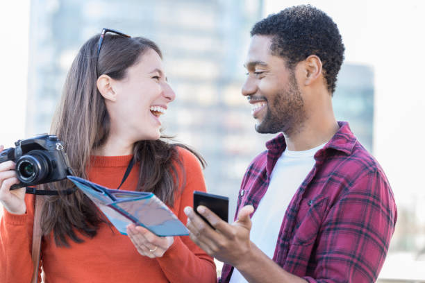 istock Young couple laugh together while on vacation 912208782