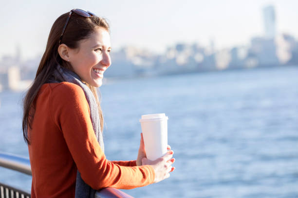 istock Young woman enjoys coffee while on vacation 912208808