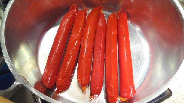istock Red sausages in a pan 912212674