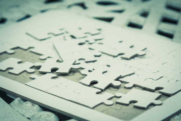 istock White Jig saw puzzle spilled out on the table 912216004