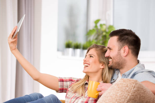 istock Young couple looking at tablet 912219380