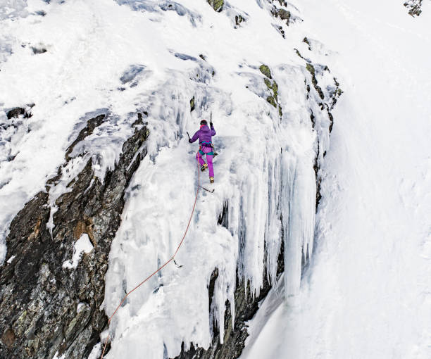 istock Woman during ice climbing day 912222852