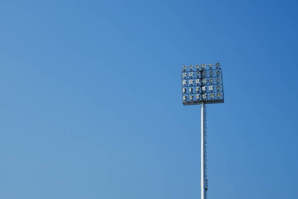 istock Spotlight on lighting tower of stadium background 912226510