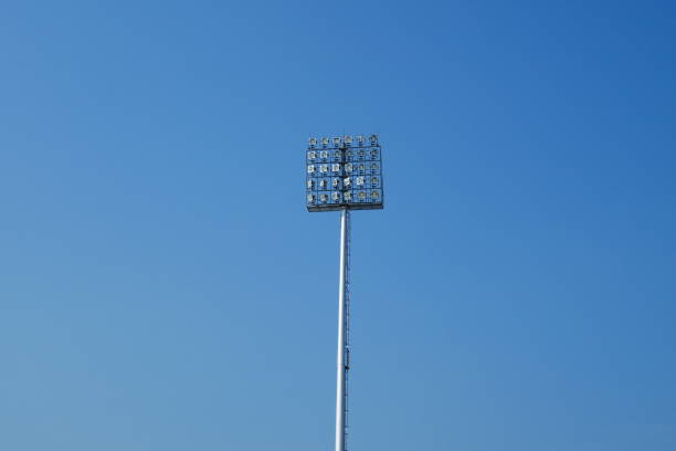 istock Spotlight on lighting tower of stadium background 912226514