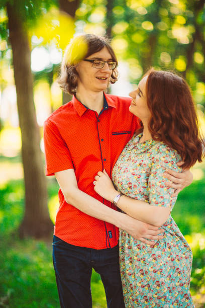 istock Beautiful young couple on the park background 912226704