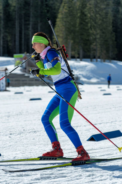 istock Side View of Young Female Biathlon Competitor Training 912230256