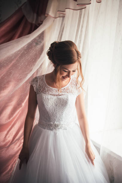 istock portrait of a young bride on a light background 912231628