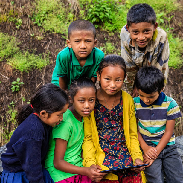 istock Nepali children using digital tablet near Annapurna Range 912231644