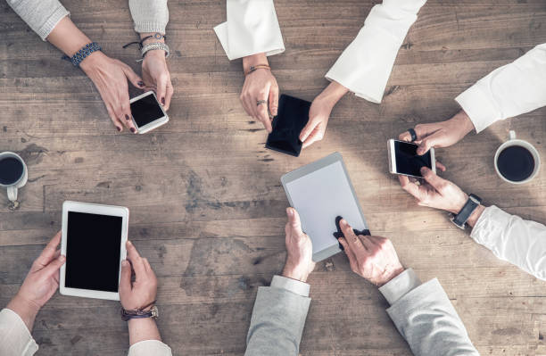 istock People are holding their mobiles on their hand 912235952