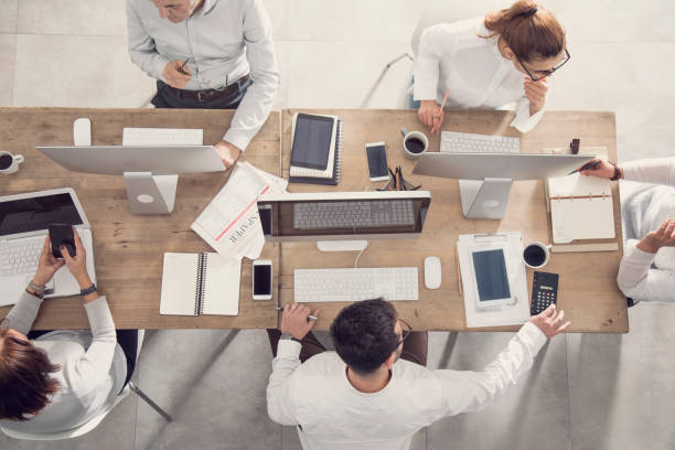 istock Business table and workers in meeting 912236786