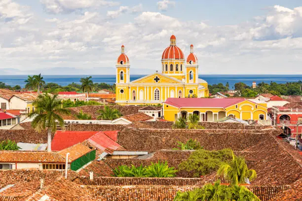 Stock photograph of the city of Granada and the landmark Cathedral of Granada in Nicaragua with Lake Nicaragua in the background.