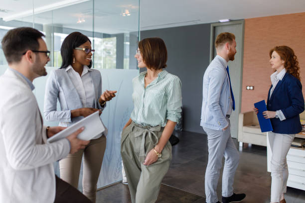 istock Business people looking at documents in office 912243050