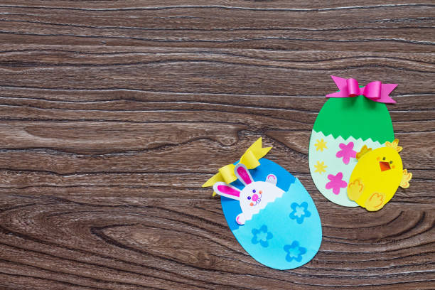 istock Children's easter egg gift with toy chicken and easter bunny. Handmade. Project of children's creativity, handicrafts, crafts for kids. Top view with copy space. 912243304