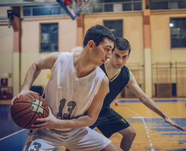 istock Two men in basketball duel 912243538
