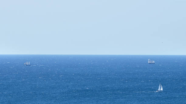 istock Calm ocean view with white sail boats and yachts 912244138