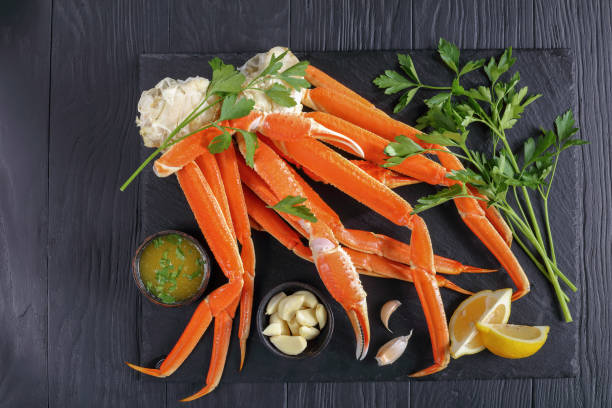 istock cooked Crab legs with melted butter sauce 912244378