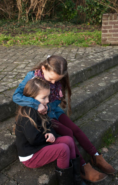 istock Little Girl Consoling Her Sister 912244544