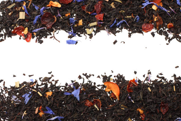 istock Aromatic black dry tea with petals isolated on white background top view 912245374