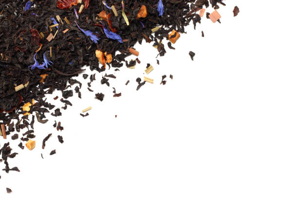 istock Aromatic black dry tea with petals isolated on white background top view 912245388