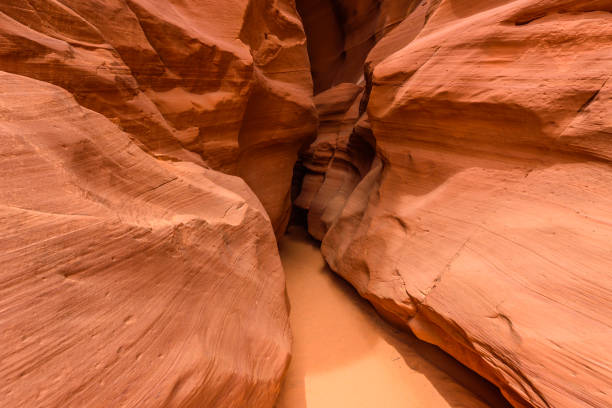 istock Small Path through Upper Antelope Canyon. Natural rock formation in beautiful colors. Beautiful wide angle view of amazing sandstone formations. Near Page at Lake Powell, Arizona, USA 912246288
