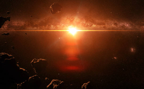 istock a swarm of asteroids lit by a bright star 912248546