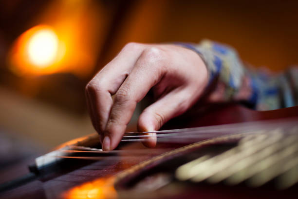 istock Detail of a hand playing guitar 912251480