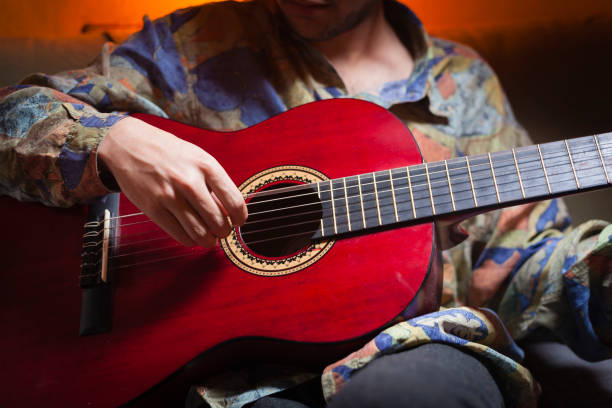 istock Man playing acoustic guitar. 912251494