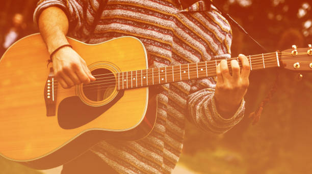 istock Guy play guitars in city park outdoor 912251504